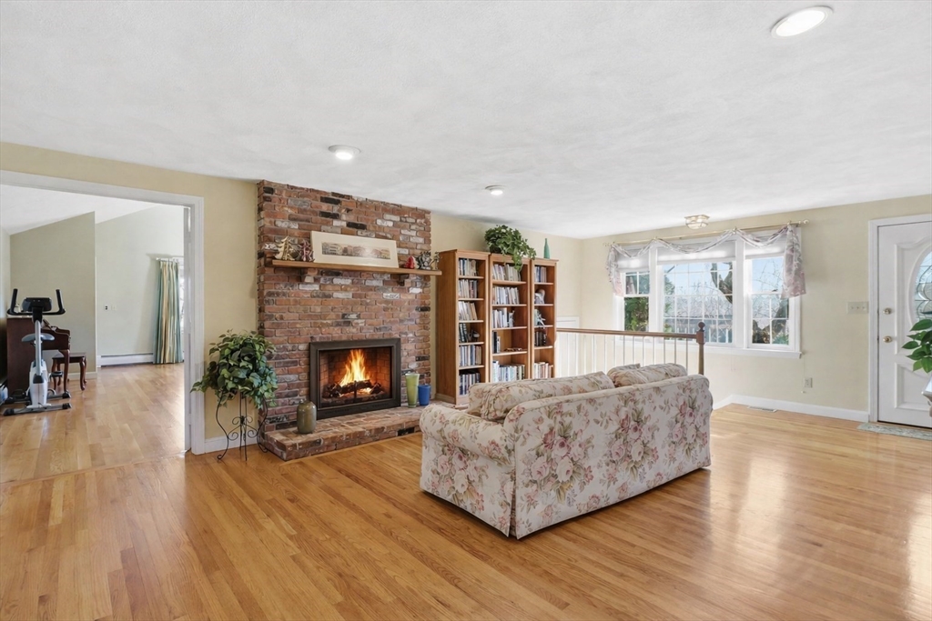 90 Blue Ridge Road North Andover, MA 01845 - Photo 7 of 26 a living room with furniture and a fireplace