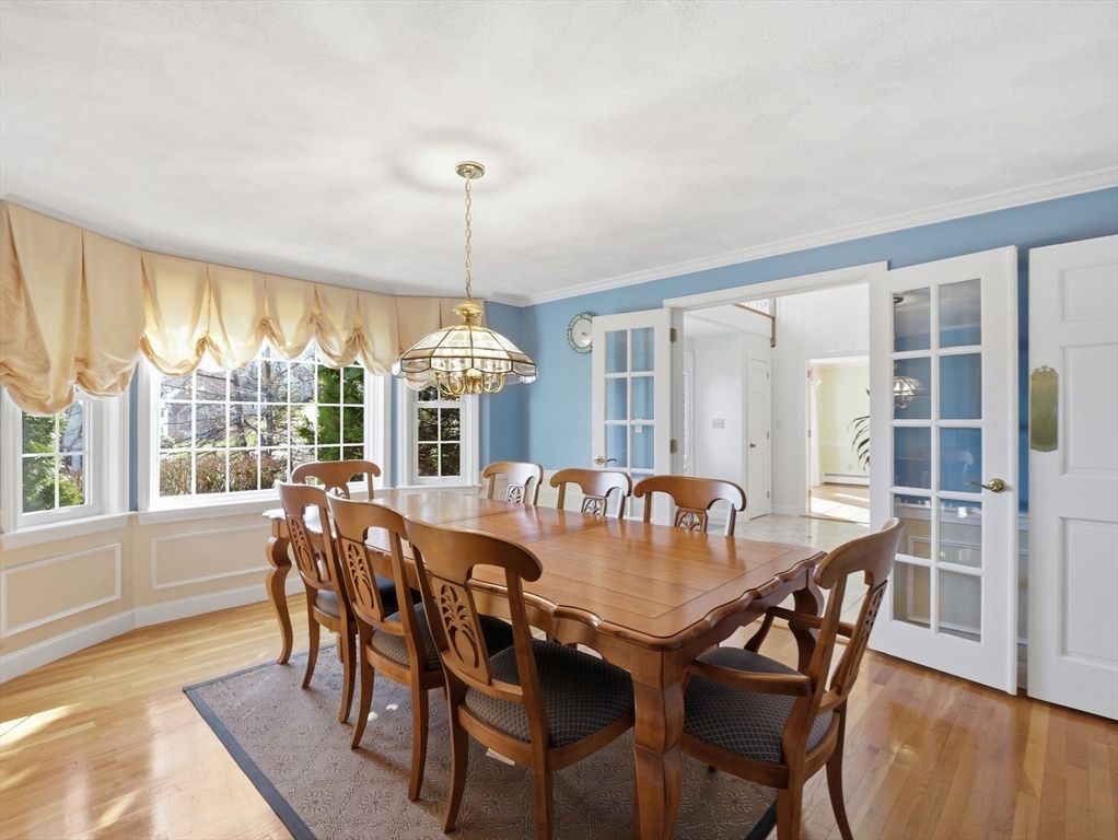 90 Blue Ridge Road North Andover, MA 01845 - Photo 9 of 26 a view of a dining room with furniture window and wooden floor