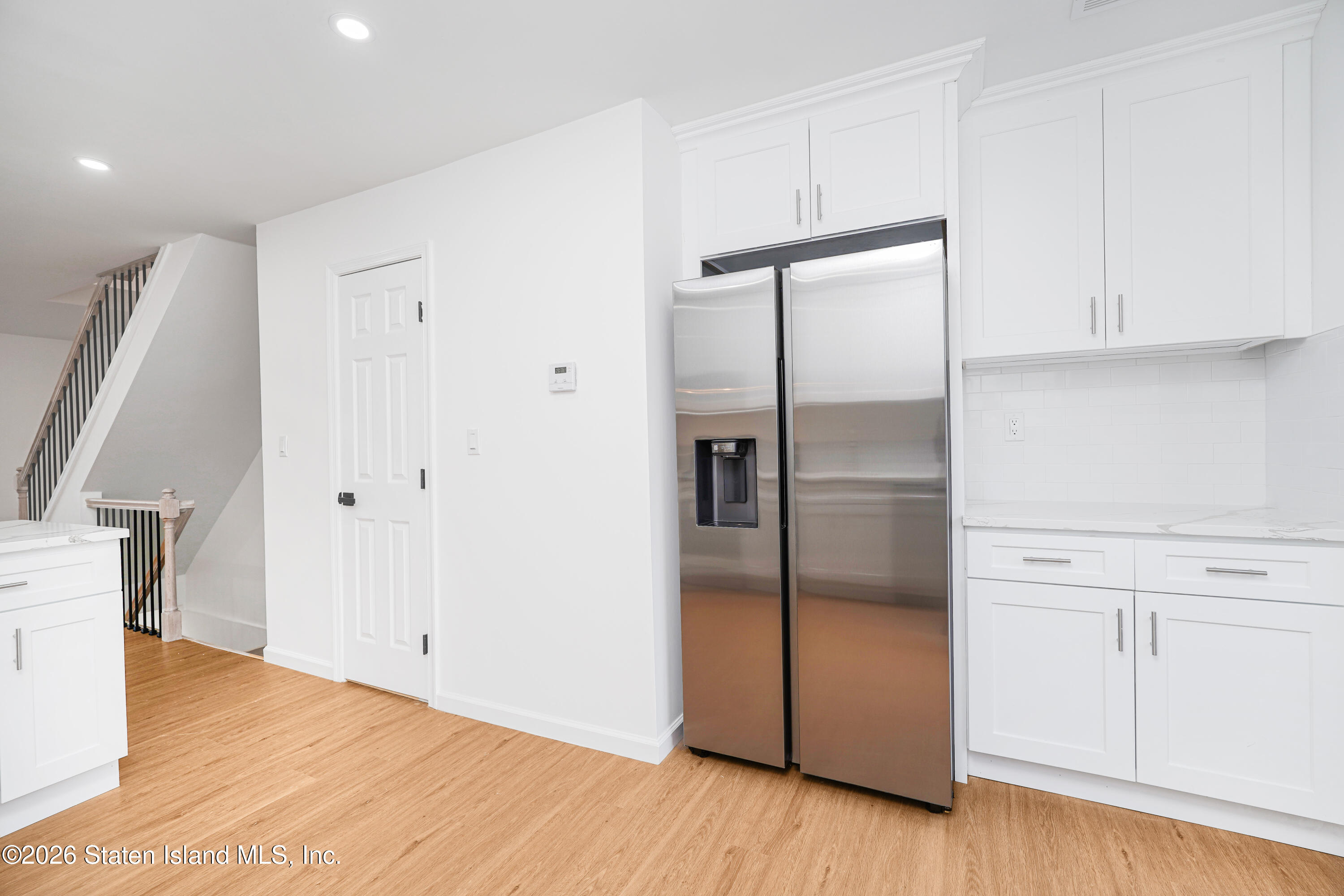 48 Studio Lane Staten Island, NY 10304 - Photo 15 of 38 a kitchen with a refrigerator and cabinets