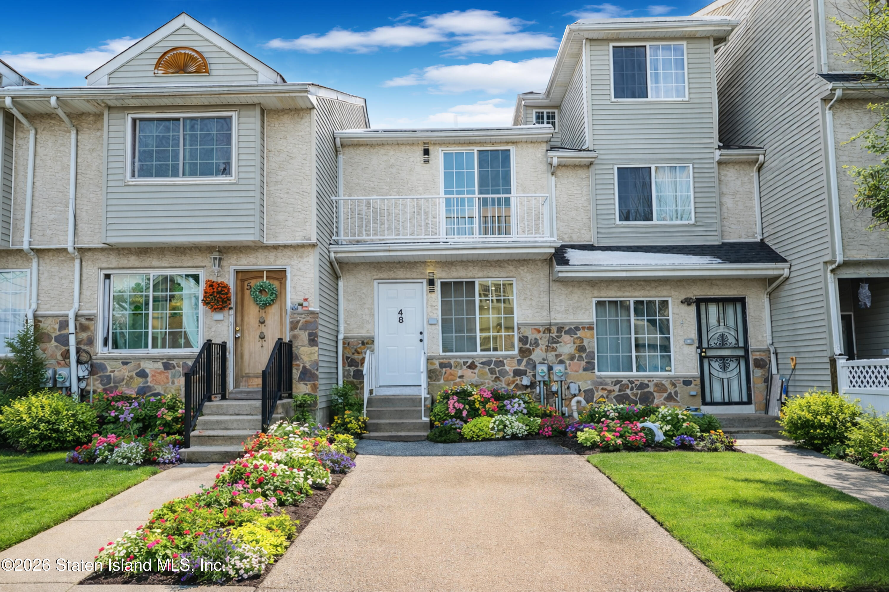 48 Studio Lane Staten Island, NY 10304 - Photo 3 of 38 a front view of a house with garden
