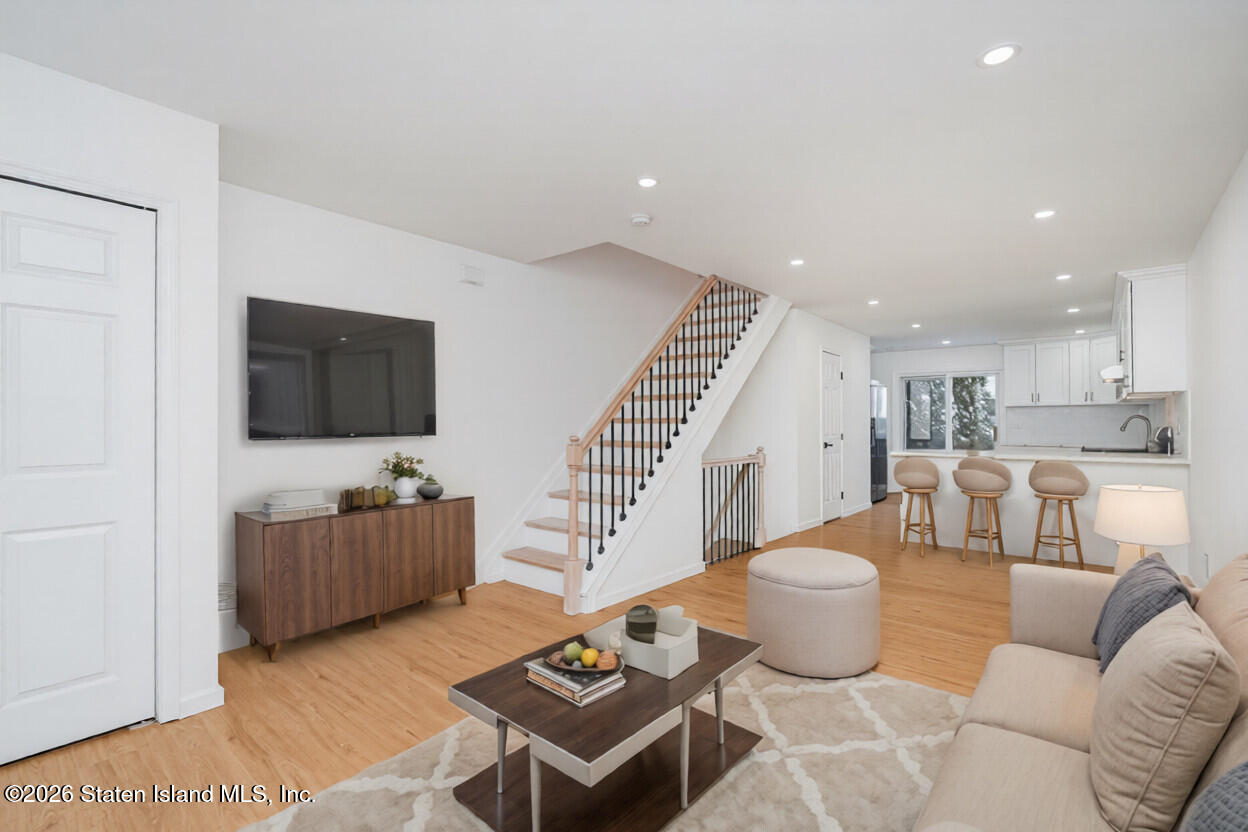 48 Studio Lane Staten Island, NY 10304 - Photo 33 of 38 a living room with furniture and a flat screen tv