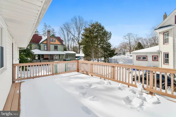 a view of a house with wooden fence