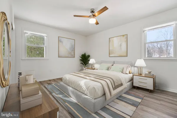 a bedroom with bed and a couch