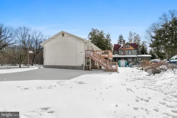 a view of a backyard of the house
