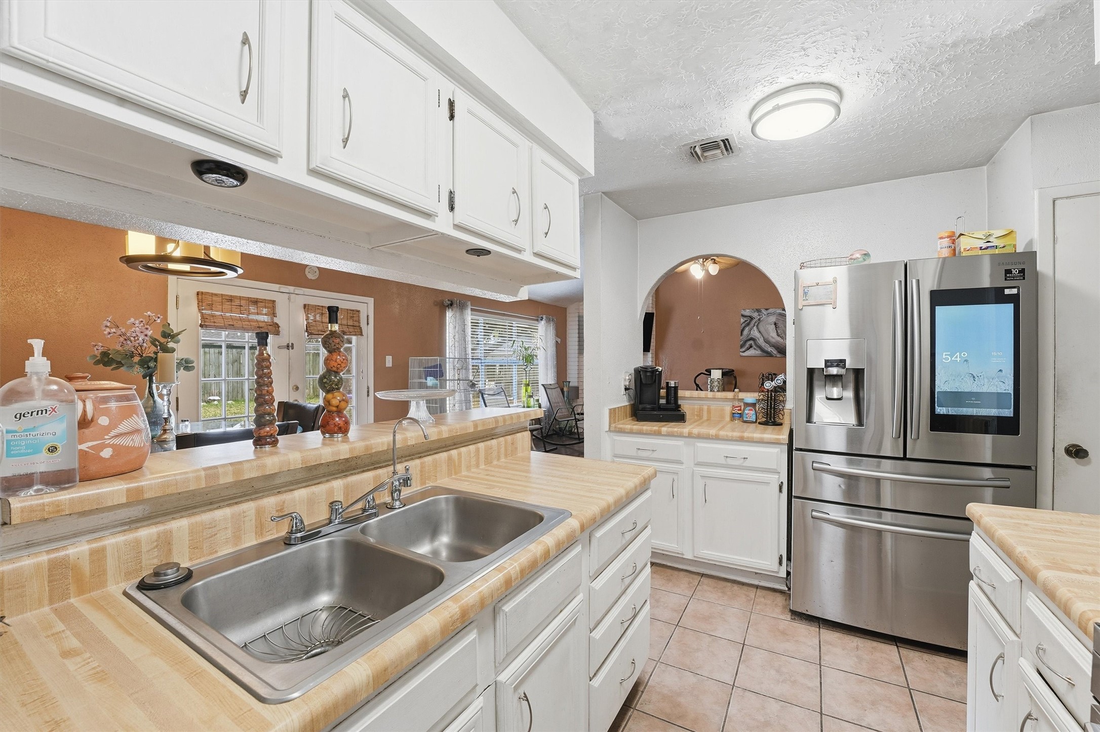 1322 Great Dover Circle Channelview, TX 77530 - Photo 11 of 19 a kitchen with stainless steel appliances granite countertop a sink and a refrigerator