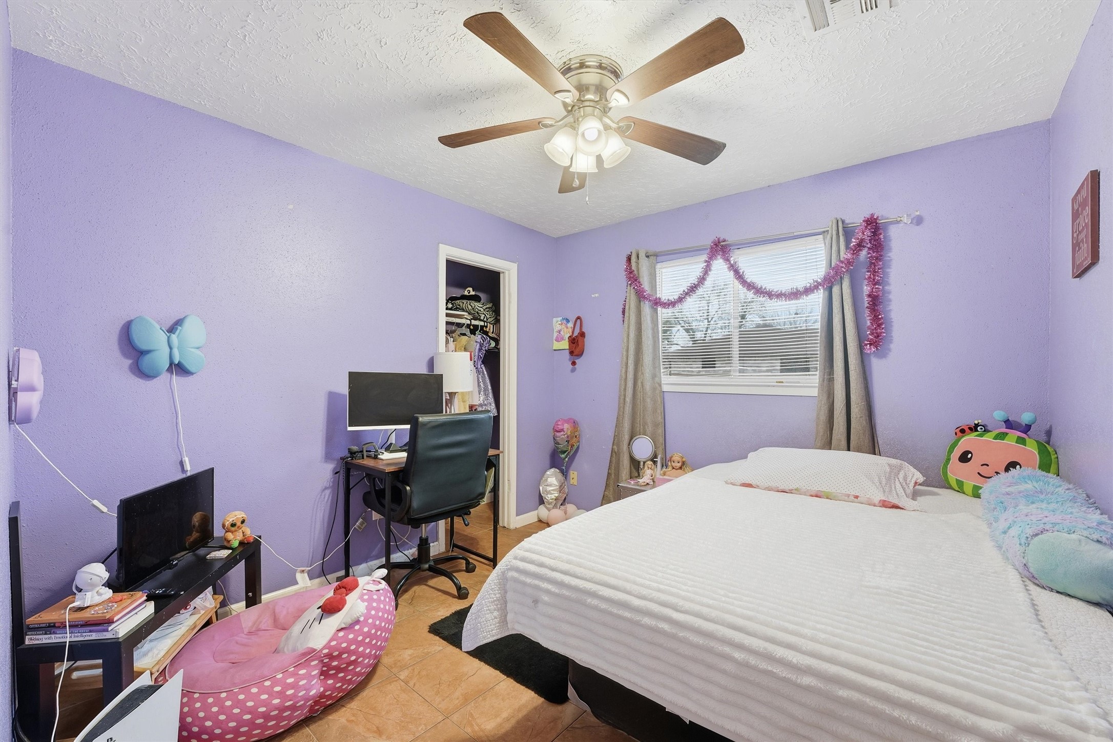 1322 Great Dover Circle Channelview, TX 77530 - Photo 15 of 19 a bedroom with a bed and a flat screen tv
