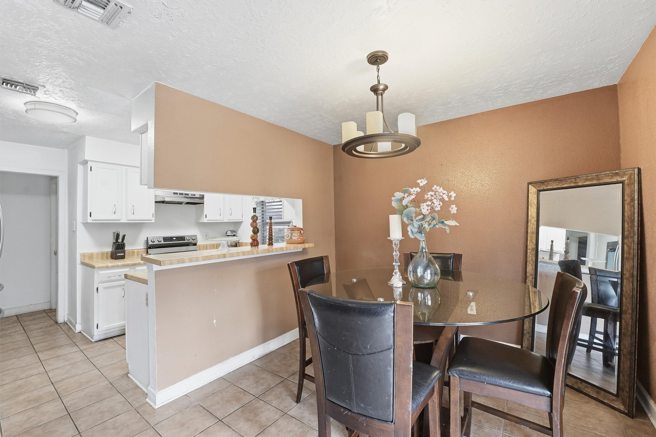 1322 Great Dover Circle Channelview, TX 77530 - Photo 7 of 19 a view of a dining room with furniture and chandelier