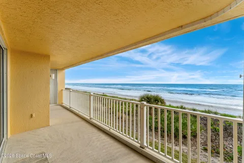 a view of balcony with wooden floor