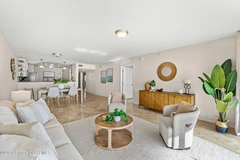 a living room with furniture and a rug
