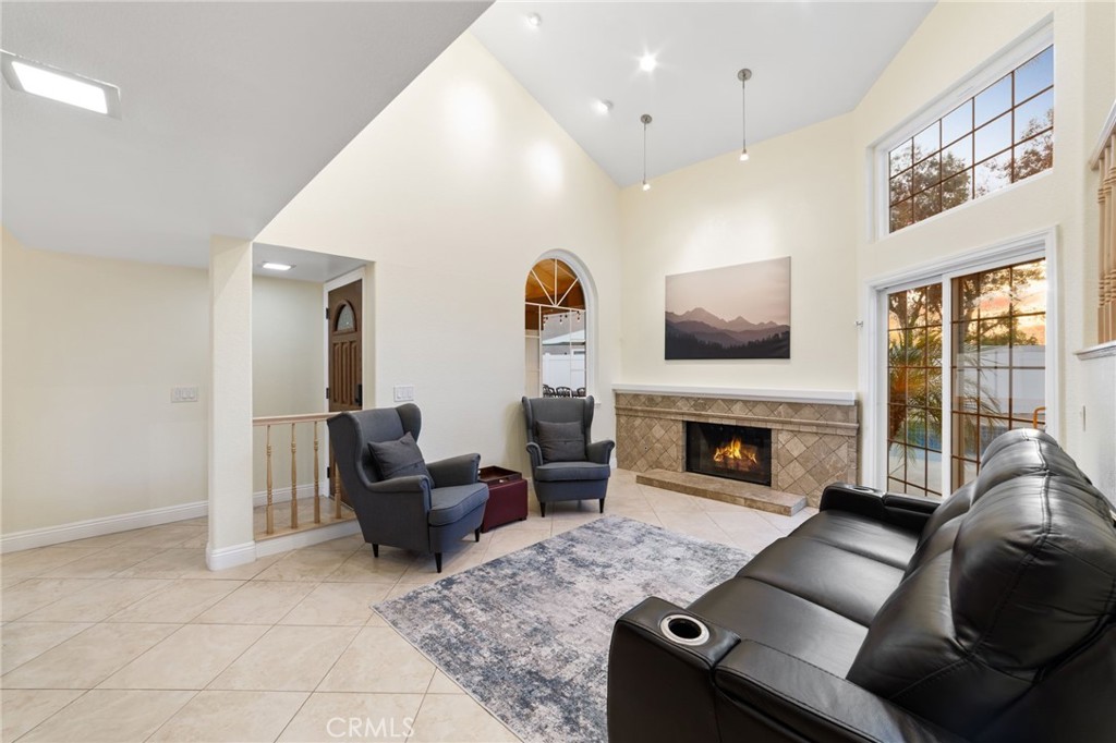 31760 Corte Tortosa Temecula, CA 92592 - Photo 13 of 46 a living room with furniture and a fireplace