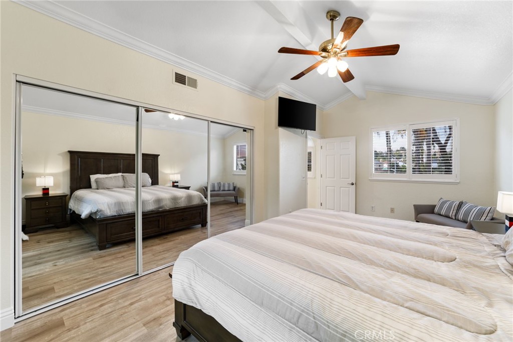 31760 Corte Tortosa Temecula, CA 92592 - Photo 23 of 46 a bedroom with a bed ceiling fan and a large window
