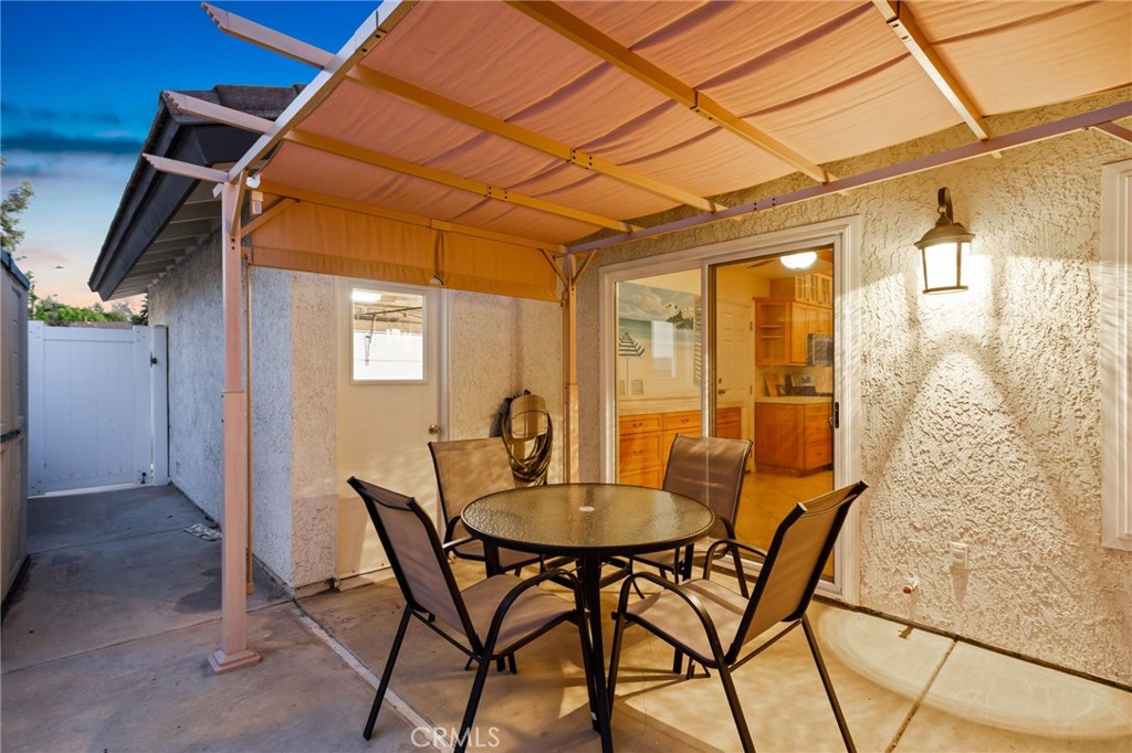 31760 Corte Tortosa Temecula, CA 92592 - Photo 32 of 46 a patio with table and chairs and potted plants