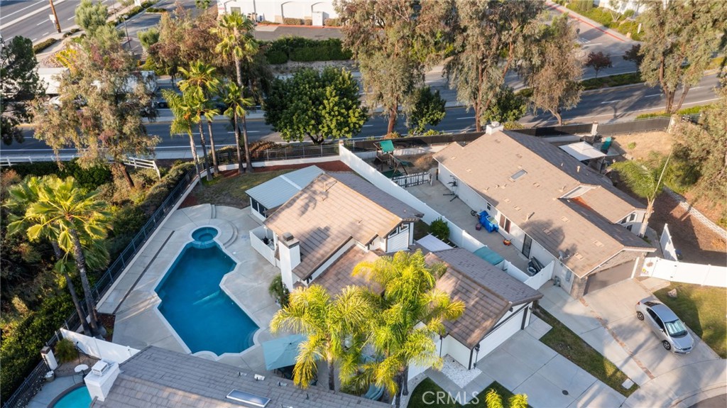 31760 Corte Tortosa Temecula, CA 92592 - Photo 34 of 46 an aerial view of a house with a garden and trees