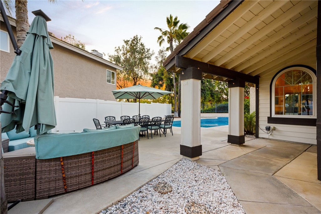 31760 Corte Tortosa Temecula, CA 92592 - Photo 38 of 46 a view of a patio with table and chairs potted plants