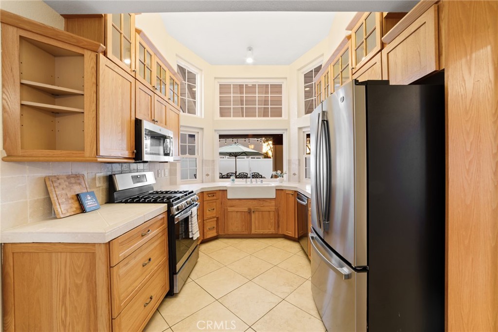 31760 Corte Tortosa Temecula, CA 92592 - Photo 8 of 46 a kitchen with stainless steel appliances a refrigerator sink and cabinets