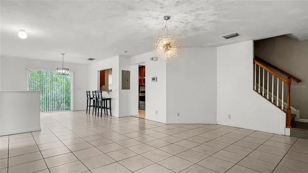 a view of a livingroom with furniture and an entryway