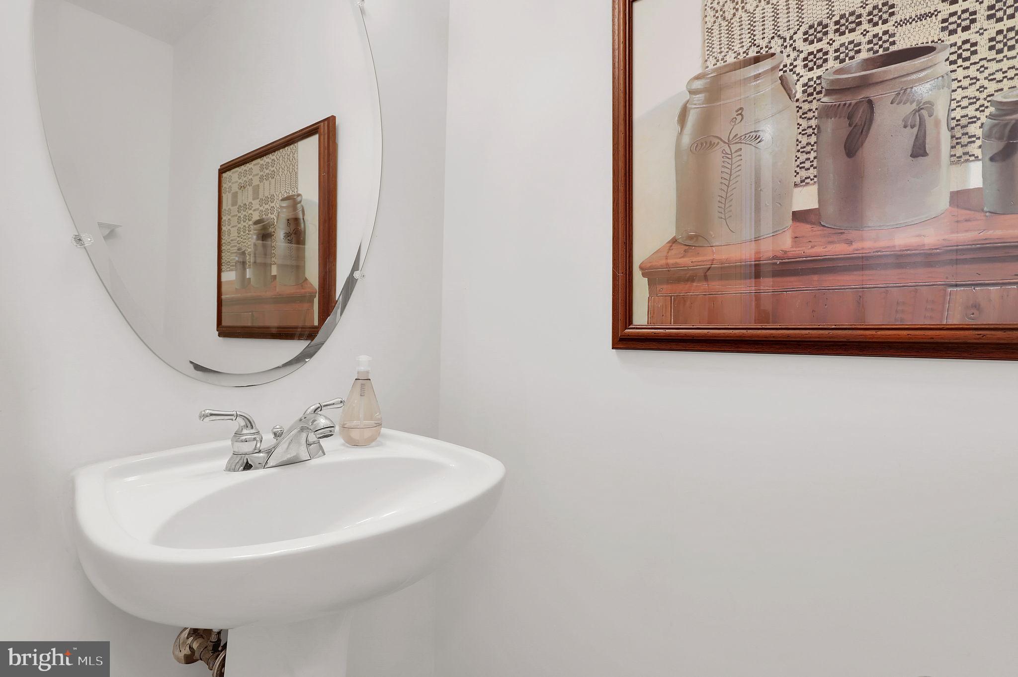 3006 Novak Terrace Burtonsville, MD 20866 - Photo 18 of 71 a bathroom with a sink and a mirror