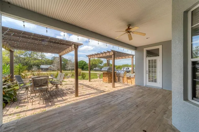 a living room with hardwood floor and balcony