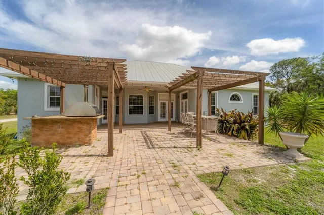 a view of a house with dining area and furniture