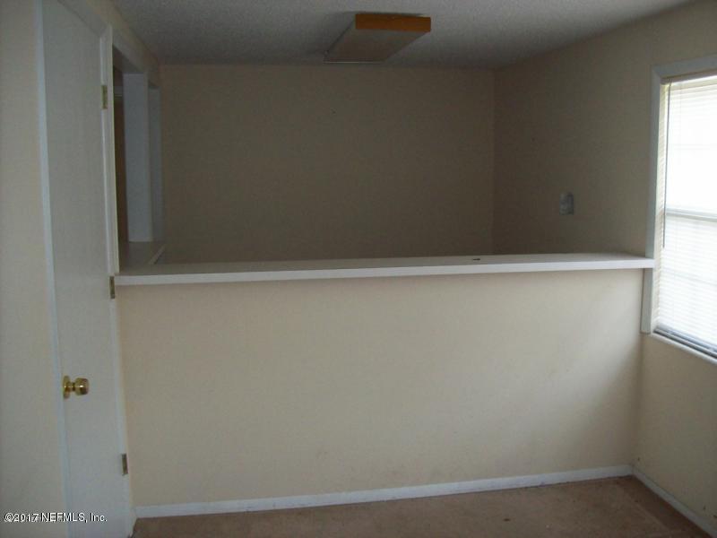 904 New Berlin Road Jacksonville, FL 32218 - Photo 14 of 19 a close up view of racks on the wall