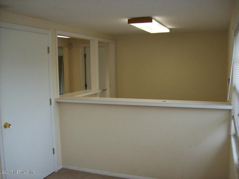 904 New Berlin Road Jacksonville, FL 32218 - Photo 2 of 19 an empty room with a window