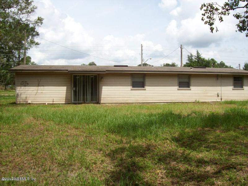 904 New Berlin Road Jacksonville, FL 32218 - Photo 6 of 19 a front view of a house with garden