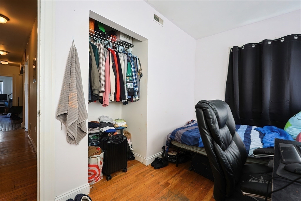 35 Adamson Street, Unit 2 Boston, MA 02134 - Photo 11 of 15 a view of walk in closet with clothes and shoes