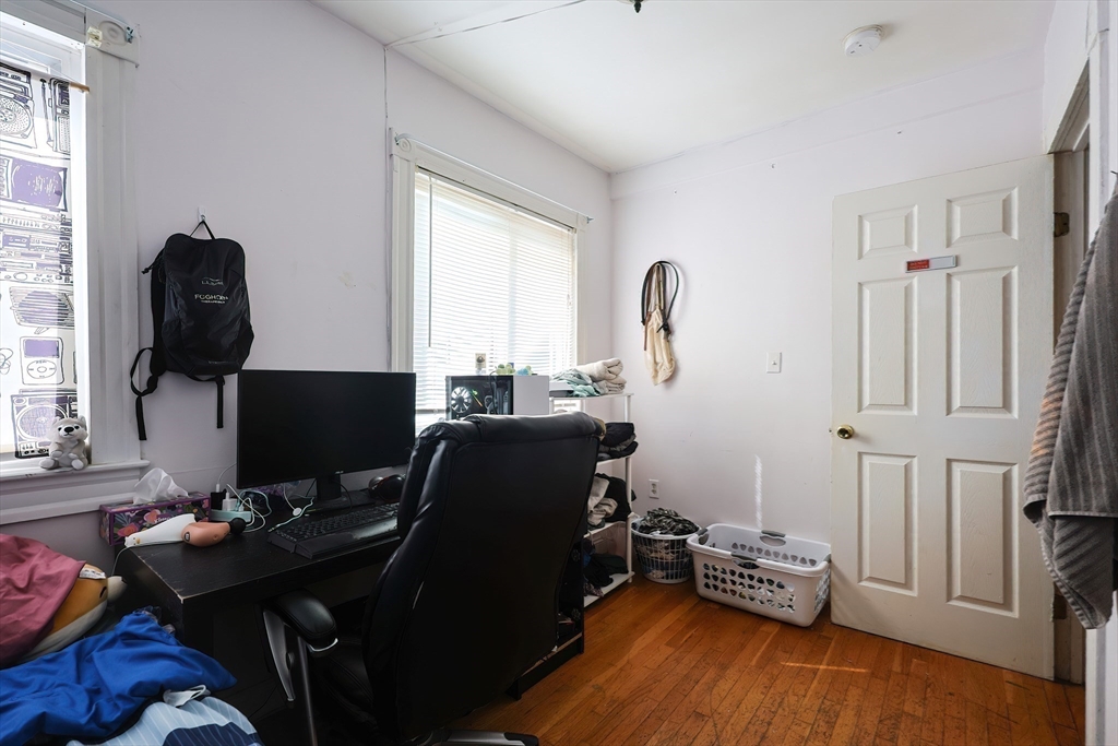 35 Adamson Street, Unit 2 Boston, MA 02134 - Photo 12 of 15 a view of a workspace with furniture and a window