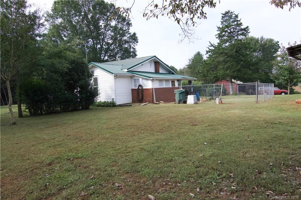 5812 Gilbert Hilton Road Vale, NC 28168 - Photo 21 of 35 a view of a house with a yard