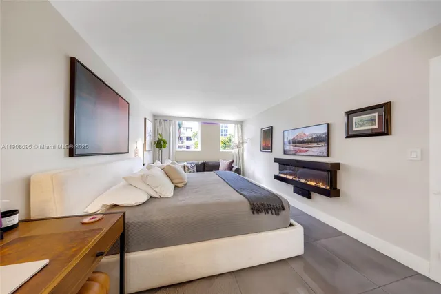 a bedroom with a bed and dresser