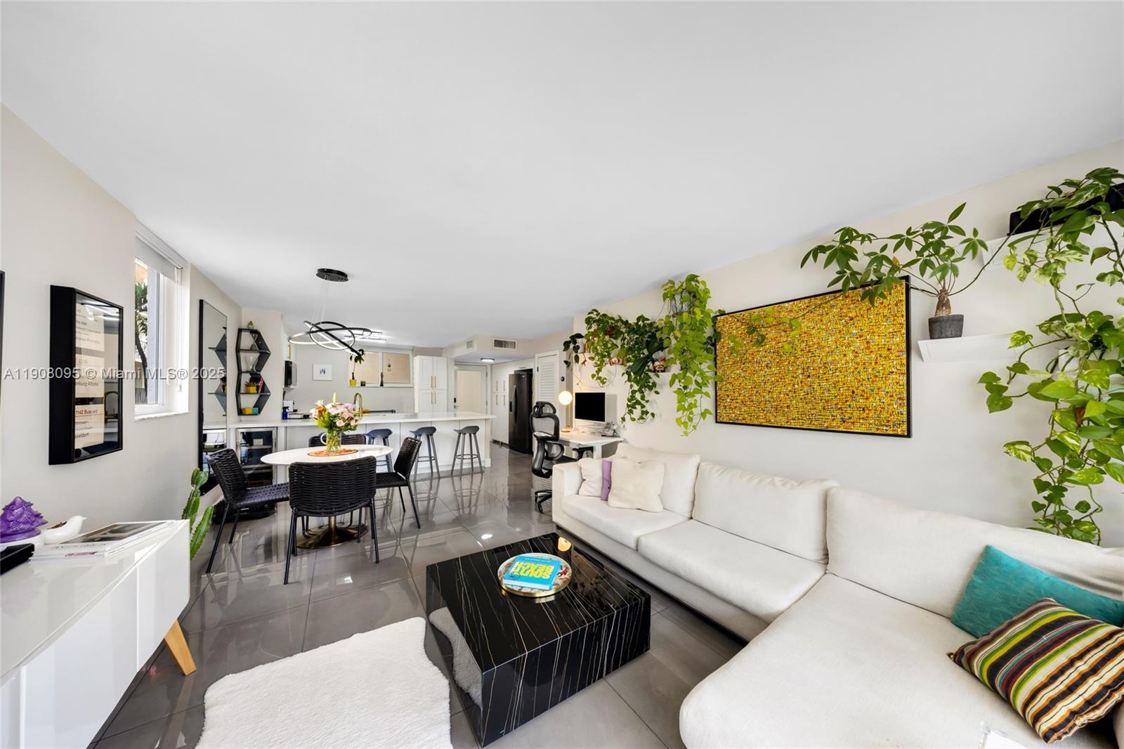 1665 Bay Road, Unit 221 Miami Beach, FL 33139 - Photo 6 of 32 a living room with furniture and a large window