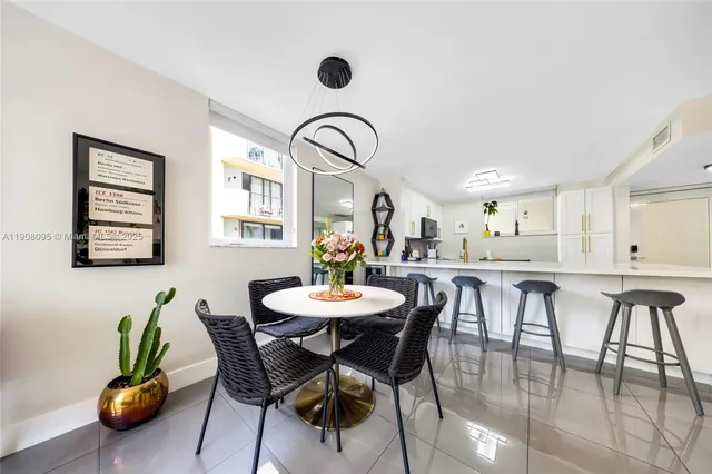 a view of a dining room with furniture and window