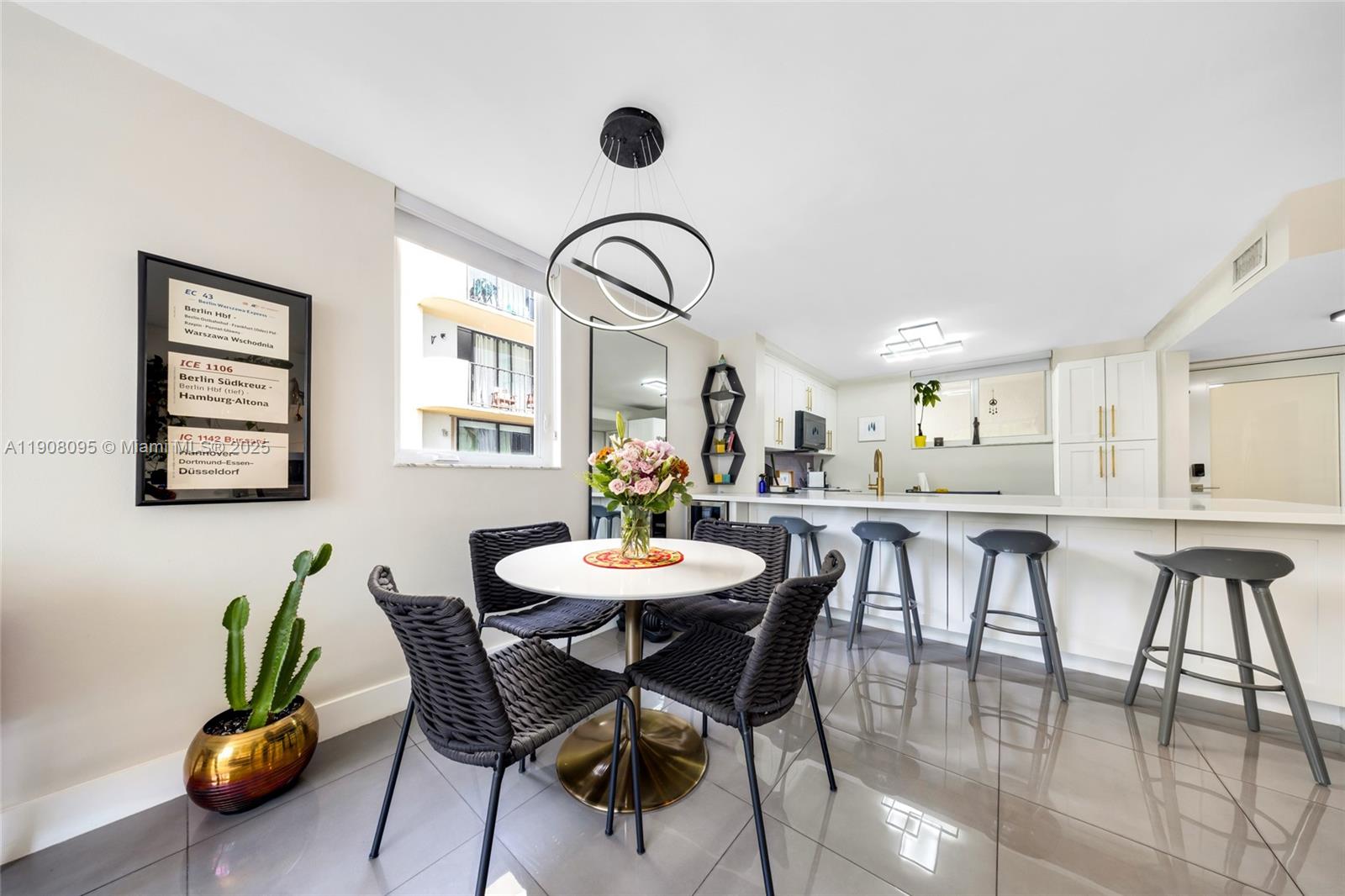 1665 Bay Road, Unit 221 Miami Beach, FL 33139 - Photo 8 of 32 a view of a dining room with furniture and window