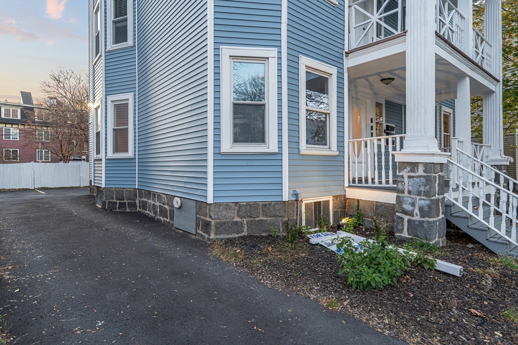 381 Adams Street, Unit 3 Boston, MA 02122 - Photo 26 of 41 a view of a house with a yard