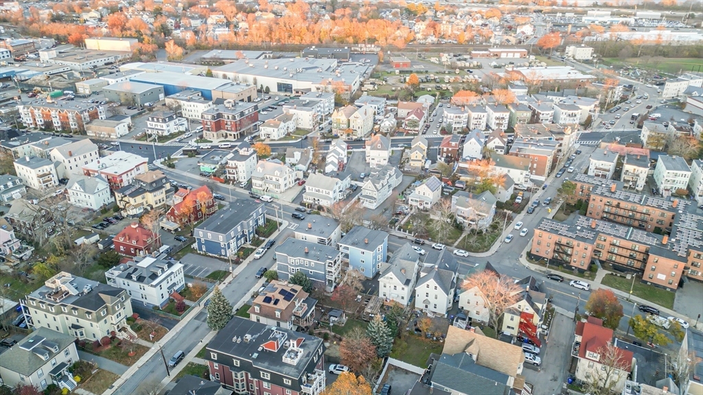 381 Adams Street, Unit 3 Boston, MA 02122 - Photo 40 of 41 an aerial view of residential houses with city view