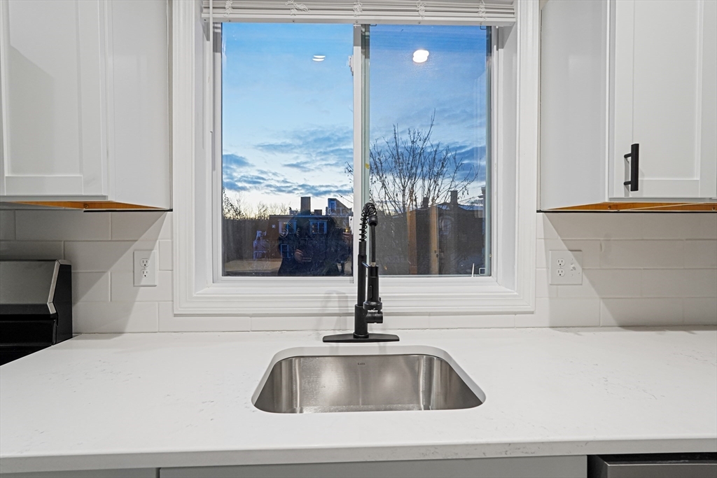 381 Adams Street, Unit 3 Boston, MA 02122 - Photo 4 of 41 a kitchen sink with a faucet