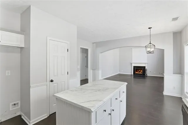a view of a kitchen cabinets and a wooden floor