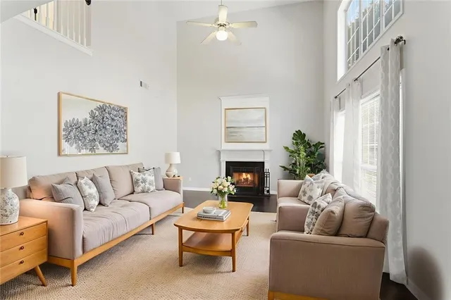 a living room with furniture and a fireplace