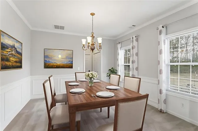 a view of a dining room with furniture window and wooden floor