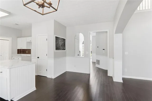 wooden floor with white walls