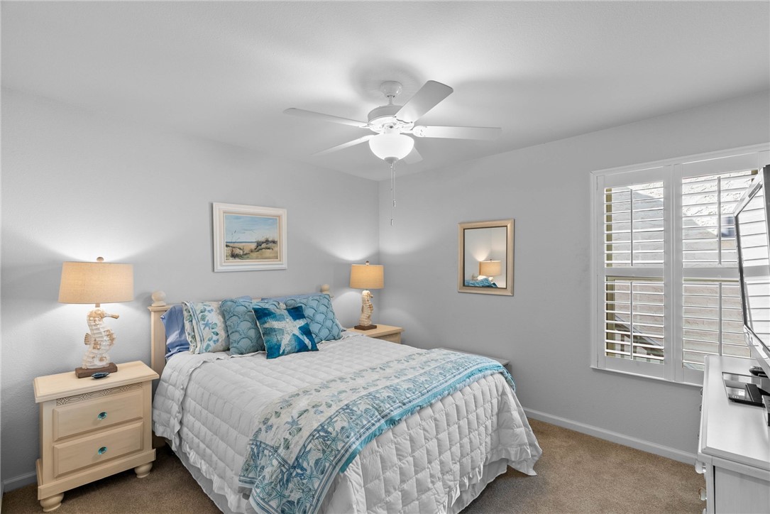 620 South Fulton Beach Road, Unit 611 Rockport, TX 78382 - Photo 9 of 15 a bedroom with a bed and a window