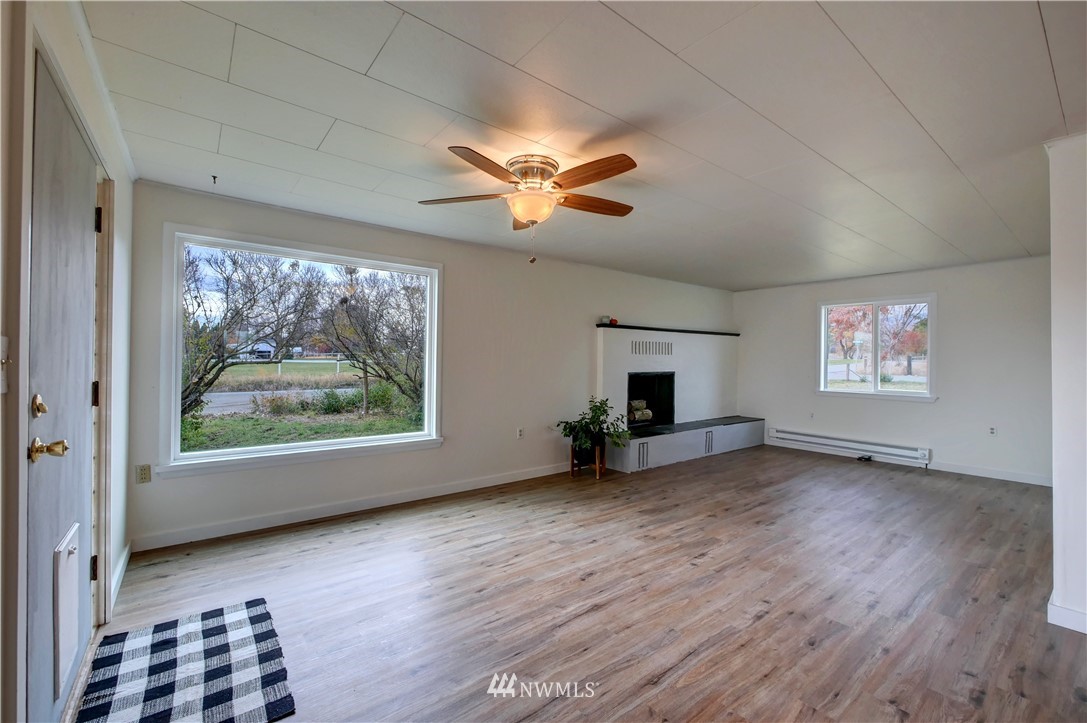 28 Fiker Road Omak, WA 98841 - Photo 5 of 39 wooden floor in an empty room with a window