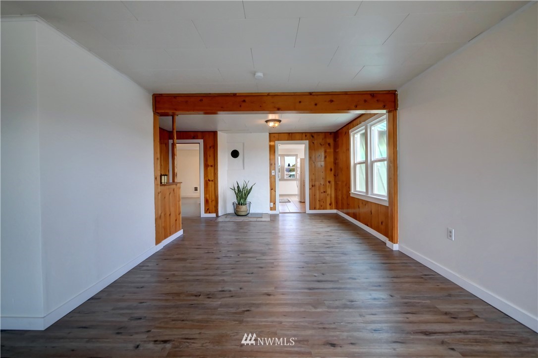 28 Fiker Road Omak, WA 98841 - Photo 7 of 39 a view of livingroom with hardwood floor and hallway