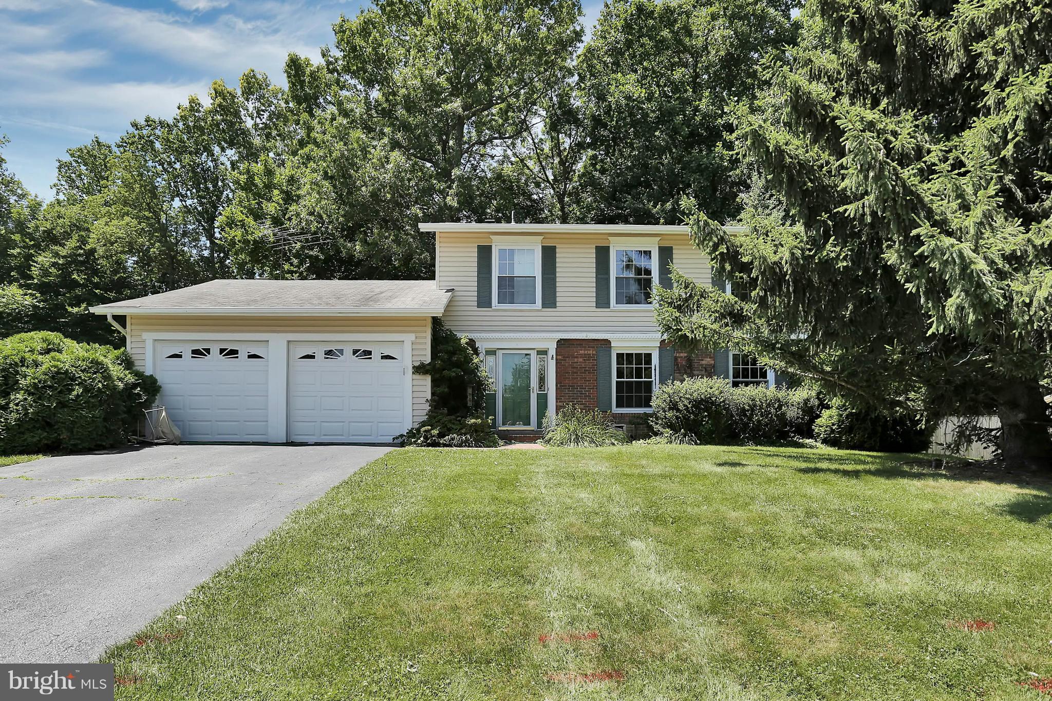 9160 Rockefeller Lane Springfield, VA 22153 - Photo 1 of 27 a house view with a sitting space and garden