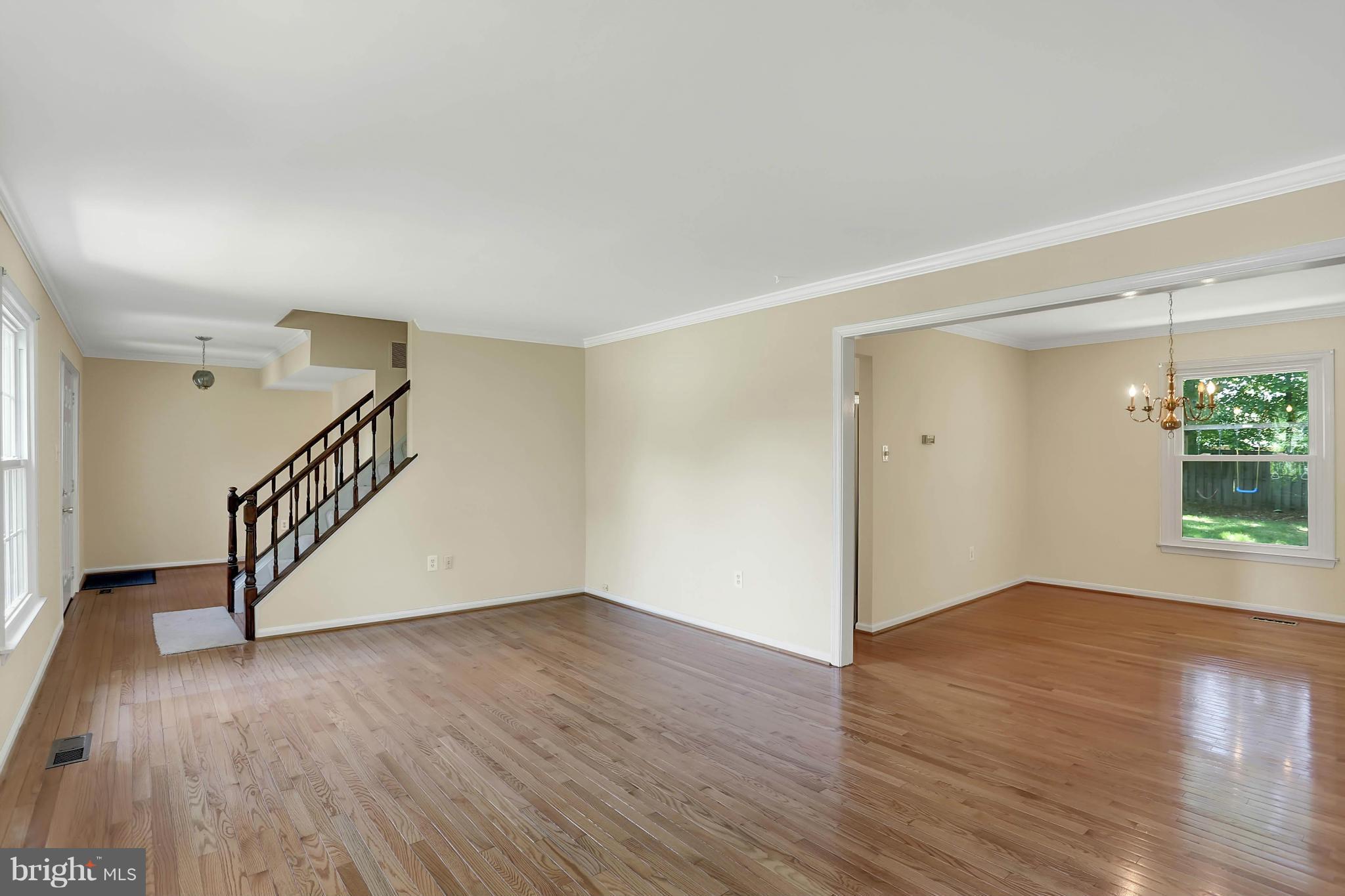 9160 Rockefeller Lane Springfield, VA 22153 - Photo 2 of 27 a view of an empty room with wooden floor and a window
