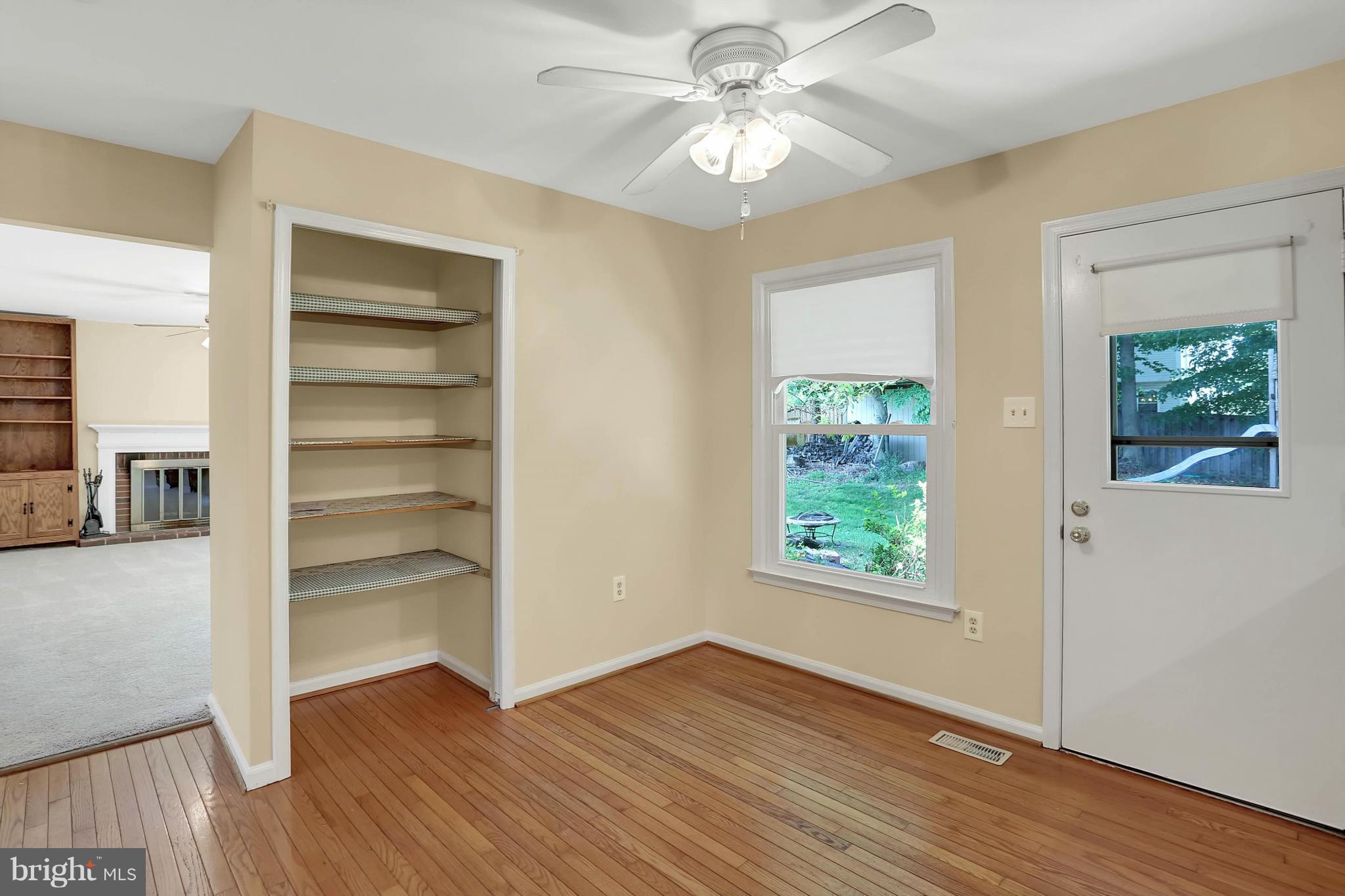 9160 Rockefeller Lane Springfield, VA 22153 - Photo 11 of 27 a view of an empty room with a window and wooden floor