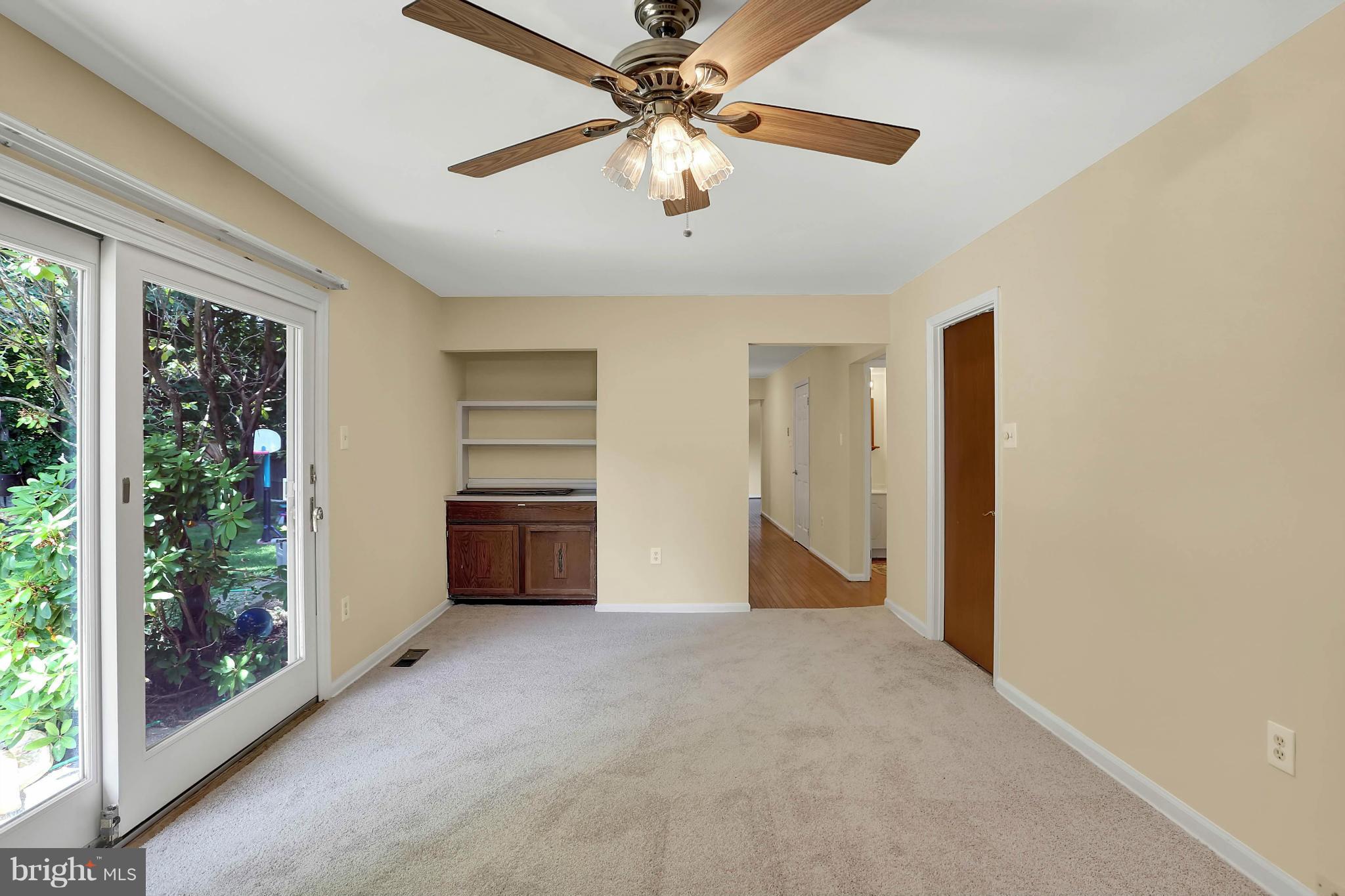 9160 Rockefeller Lane Springfield, VA 22153 - Photo 12 of 27 a view of a livingroom with a ceiling fan and window