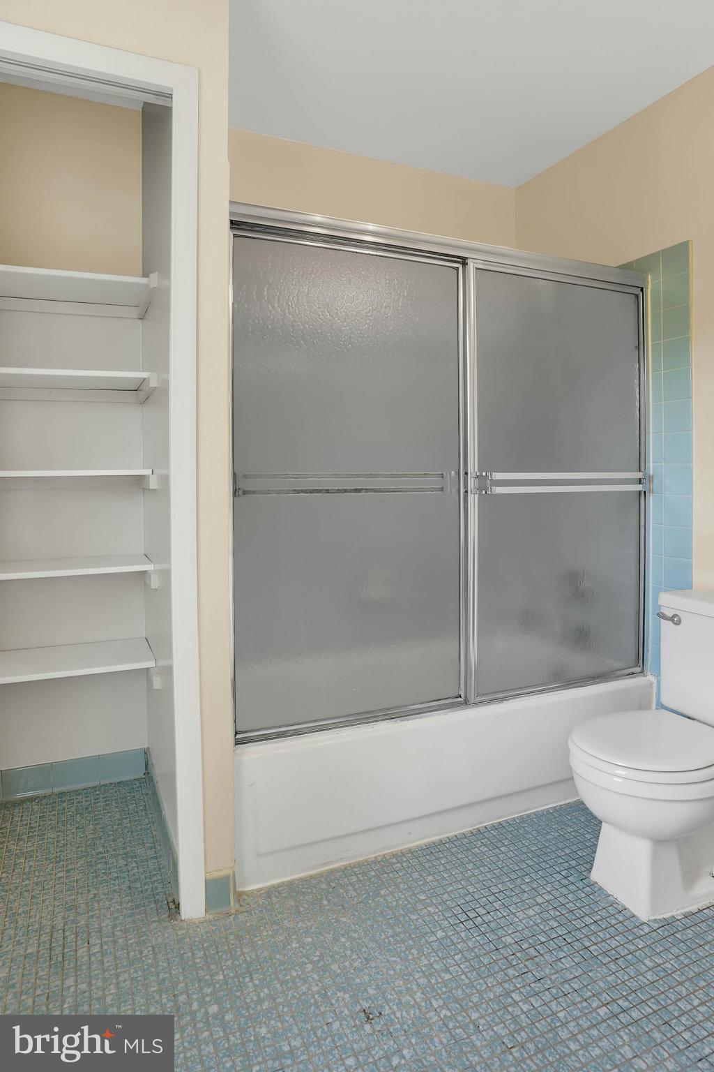 9160 Rockefeller Lane Springfield, VA 22153 - Photo 18 of 27 a bathroom with a shower and a toilet