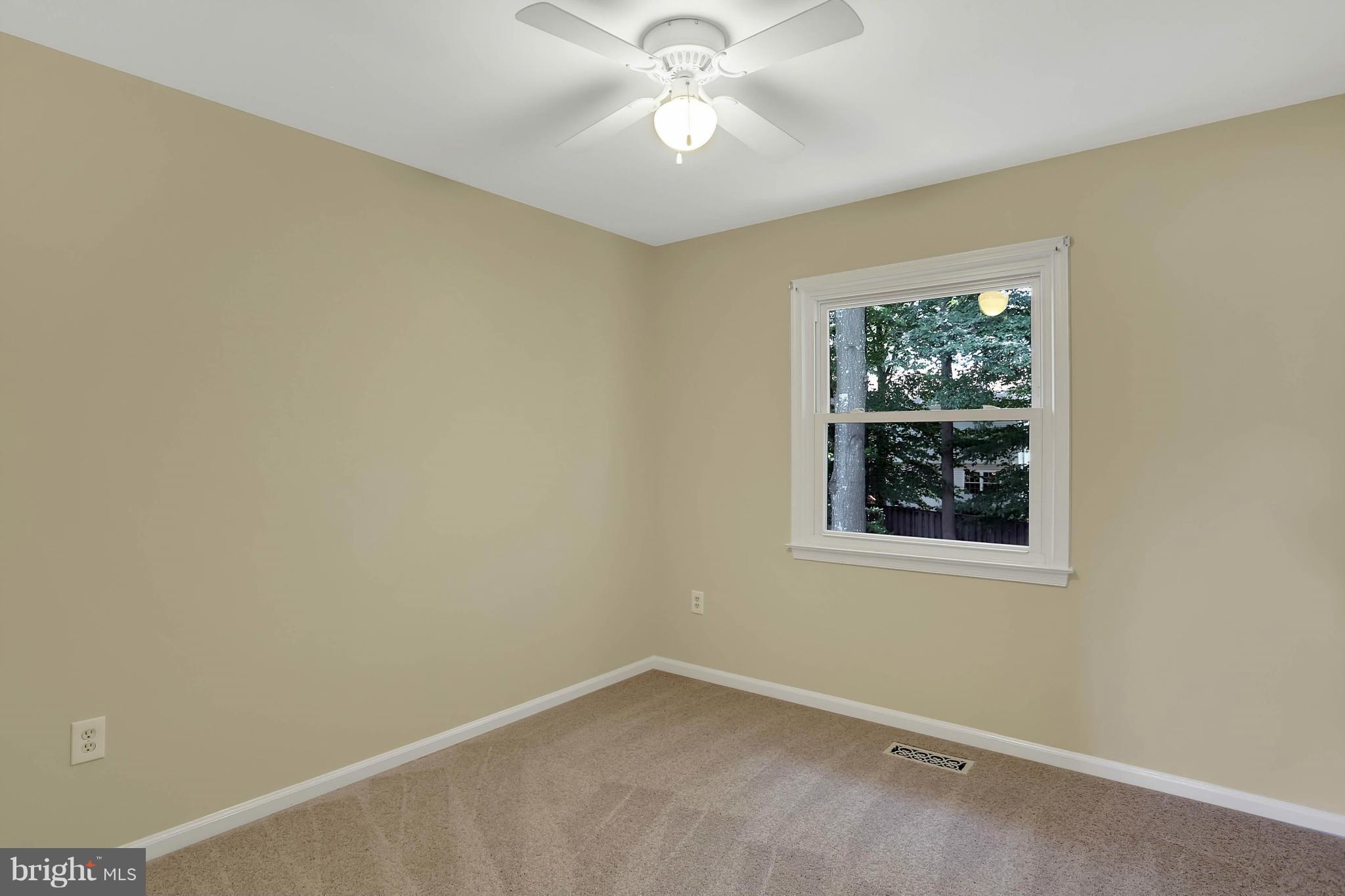 9160 Rockefeller Lane Springfield, VA 22153 - Photo 20 of 27 an empty room with a window and a fan