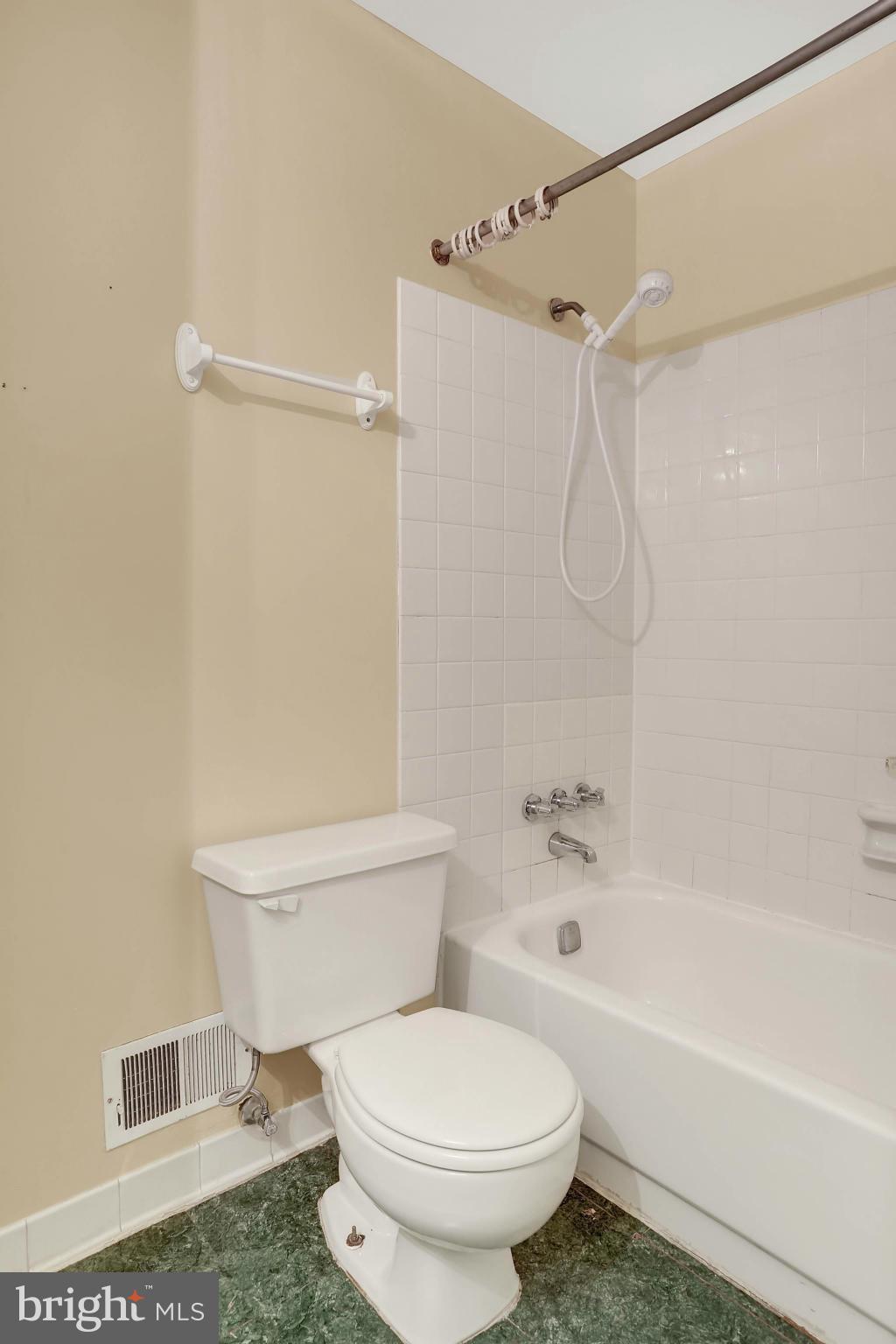 9160 Rockefeller Lane Springfield, VA 22153 - Photo 22 of 27 a bathroom with a toilet and a shower